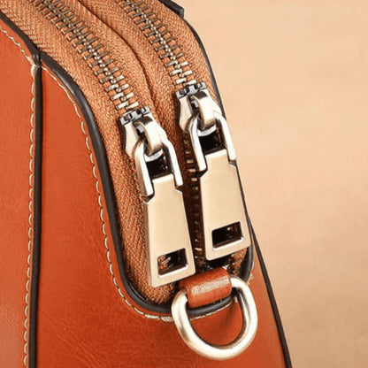 Eloria | Kompakt Crossbodytaske Med Blomsterdetalje